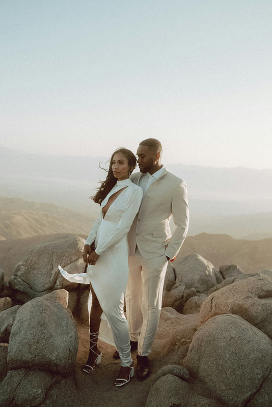 African American Couple on a mountain at sunset