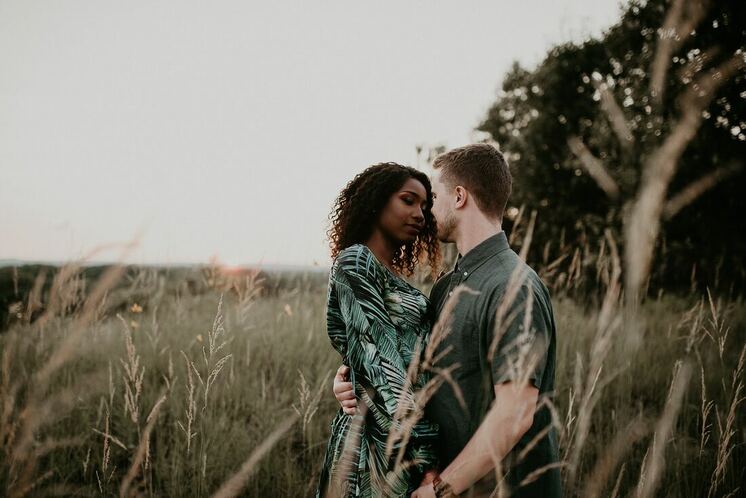 Image of Multiracial couple in a field
